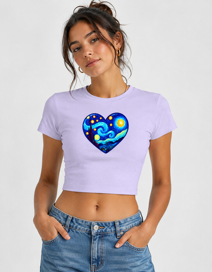 Woman wearing a purple crop top with a colorful heart design on a plain background
