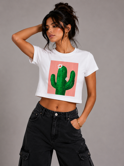 Woman wearing a white t-shirt with a cactus design on a gray background